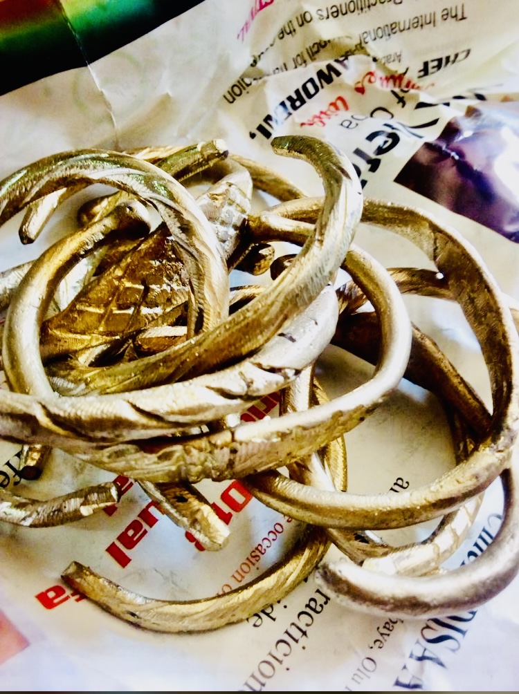 Traditional brass bangles with fish motifs